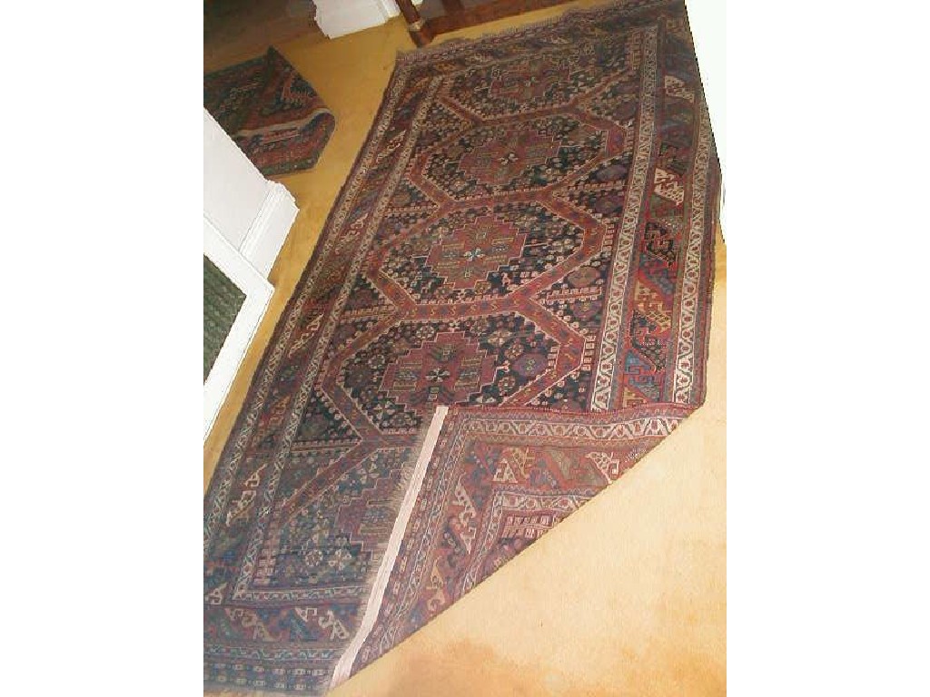 Appraisal: An Afshar rug with four central medallions and stylised border