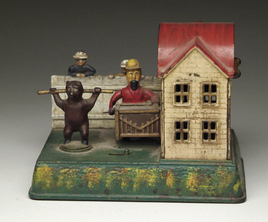 Appraisal: ORGAN GRINDER AND PERFORMING BEAR MECHANICAL BANK Wind the bank