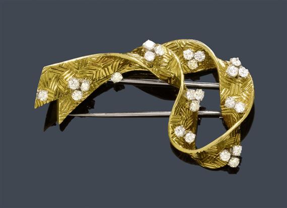 Appraisal: A GOLD AND DIAMOND CLIP-BROOCH G BELIN Yellow gold Attractive