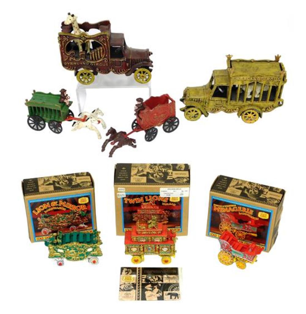 Appraisal: CIRCUS Seven cast metal and porcelain circus wagons trucks including