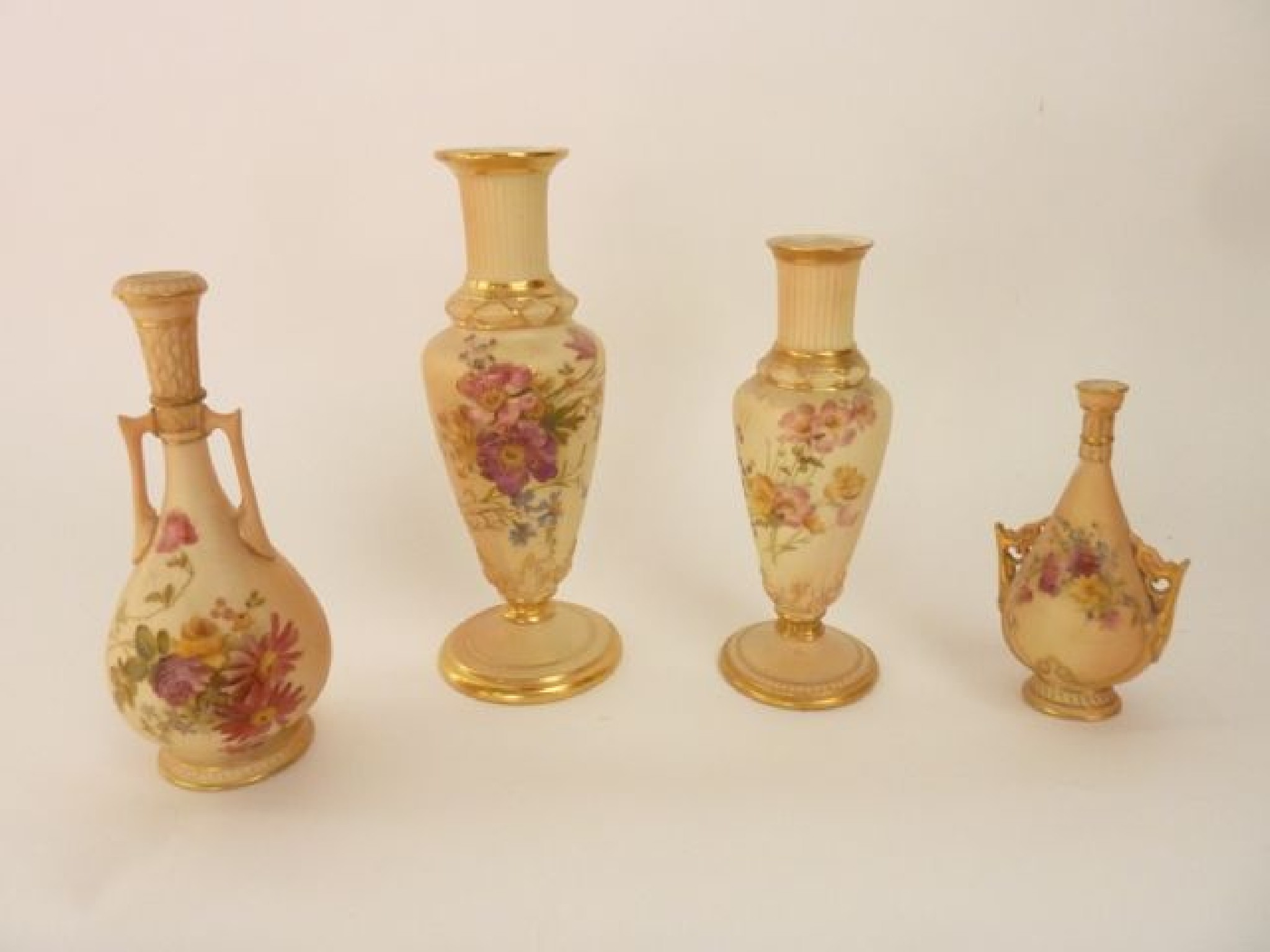 Appraisal: A collection of four Royal Worcester blush ivory vases of