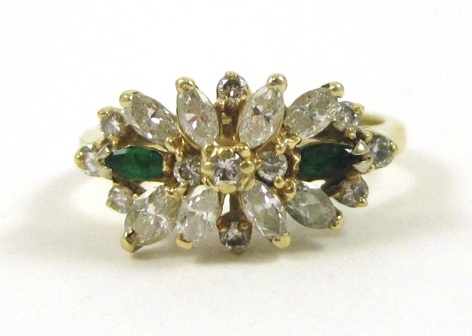 Appraisal: DIAMOND EMERALD AND FOURTEEN KARAT GOLD RING set with a