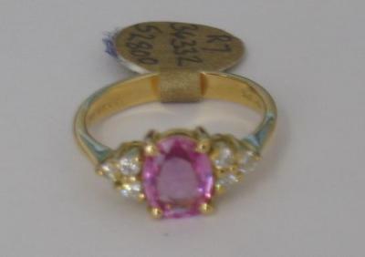 Appraisal: A PINK SAPPHIRE AND DIAMOND RING the oval cut sapphire