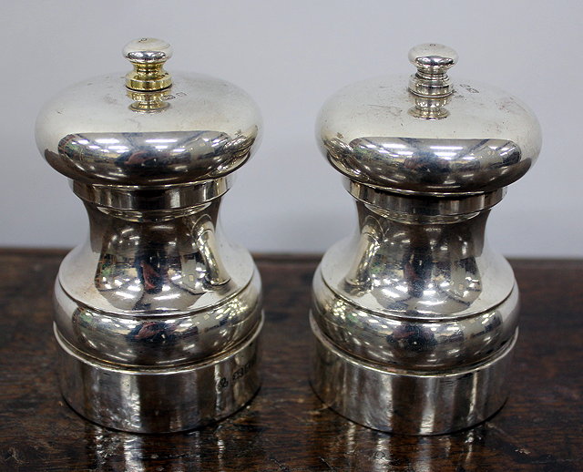 Appraisal: A PAIR OF SILVER SALT AND PEPPER MILLS marks for