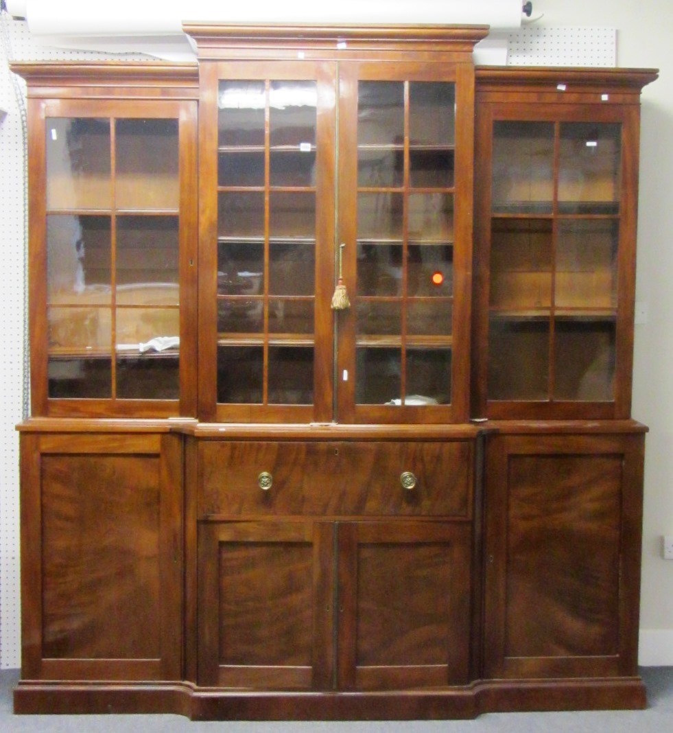 Appraisal: A Victorian mahogany breakfront secretaire bookcase with four glazed doors