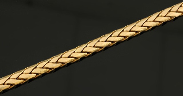 Appraisal: A gold collar The hollow plaited links weighing gms to