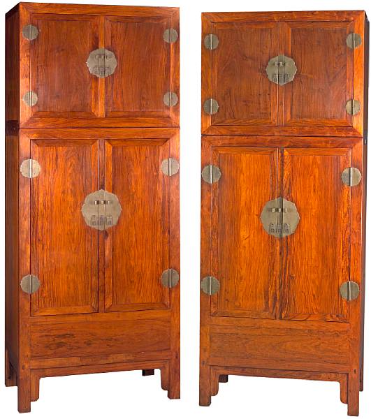 Appraisal: A massive pair of huanghuali two section hat cupboards th