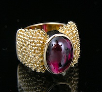 Appraisal: Michael Dawkins Garnet Oval Beaded Ring An elegant ring by