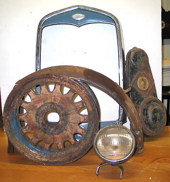 Appraisal: An assortment of motorcycle spares including a headlight rear fender