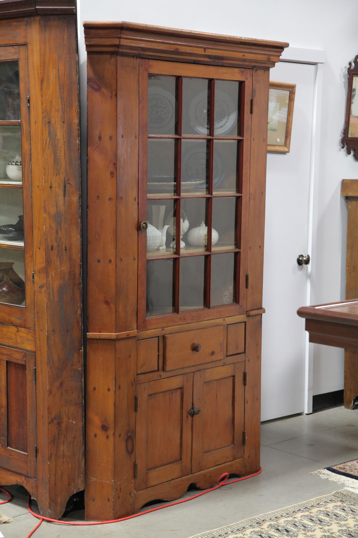 Appraisal: CORNER CUPBOARD American mid th century Pine two piece cupboard