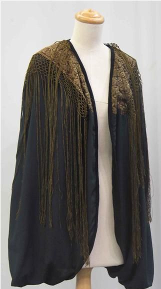 Appraisal: Black evening jacket with an embroidered overscarf in tobacco silk