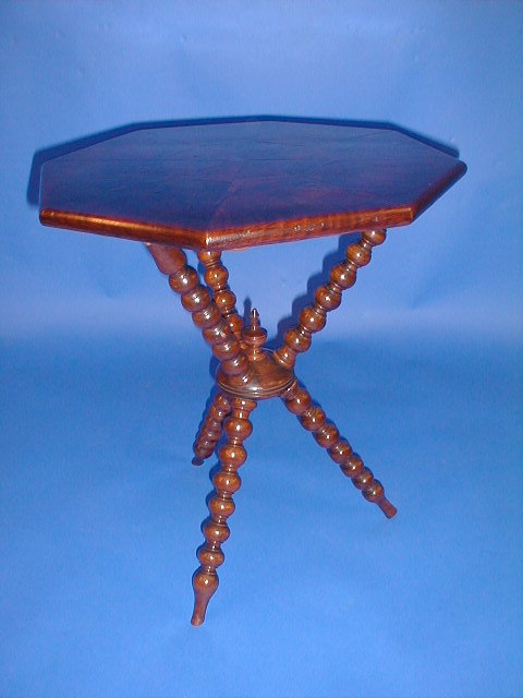 Appraisal: A Victorian gypsy table with walnut veneered octagonal top and