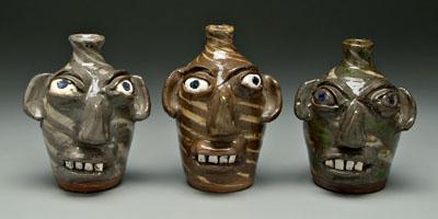 Appraisal: Three B B Craig stoneware face jugs one with swirl