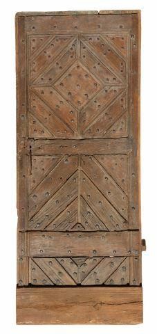 Appraisal: Architectural paneled door th c with oversized nail head accents