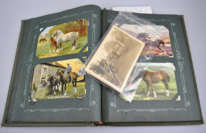 Appraisal: An early th century postcard album containing approx pictorial cards