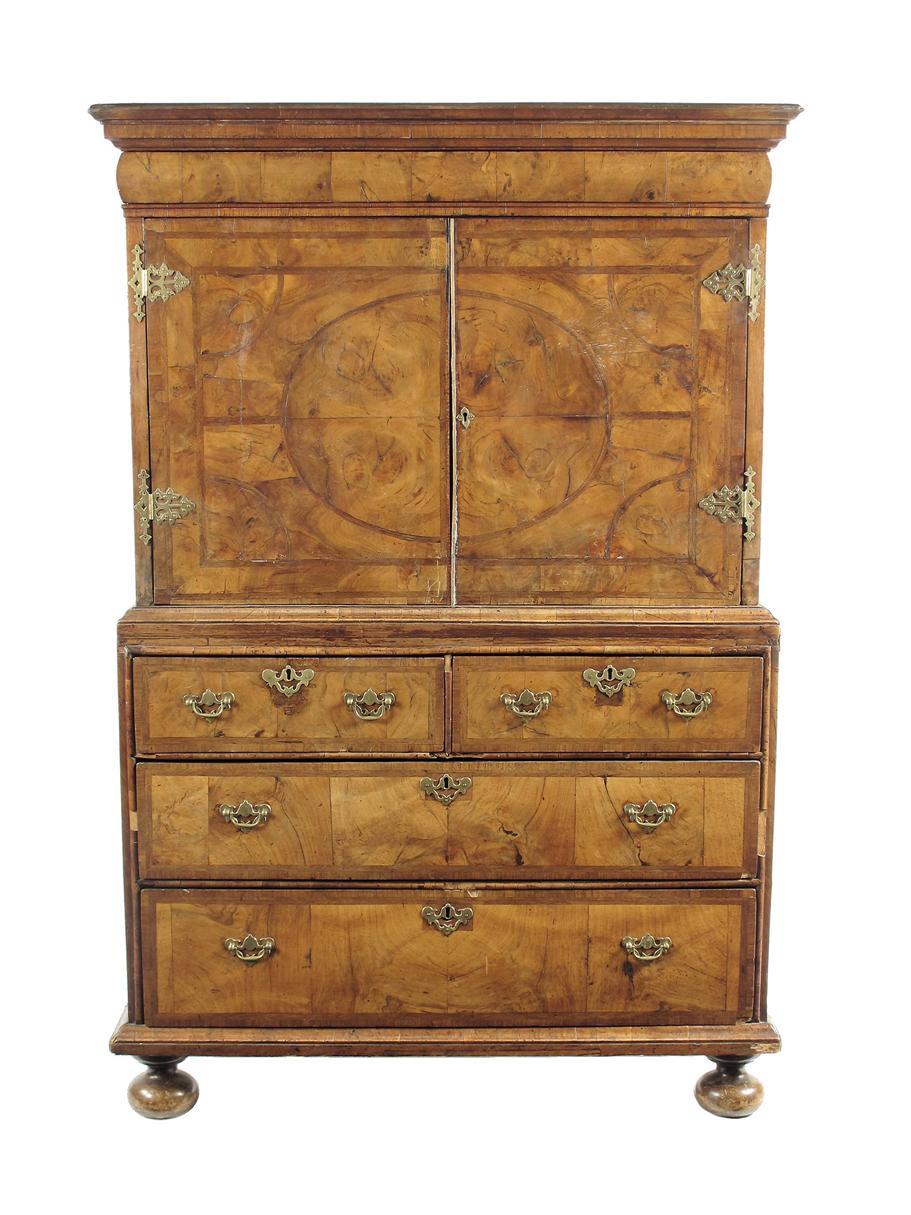 Appraisal: A walnut cabinet on chest