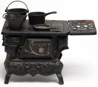 Appraisal: Crescent Cast Metal Toy Wood Stove Including pots and pans