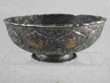 Appraisal: A white metal tests silver bowl finely decorated with lotus