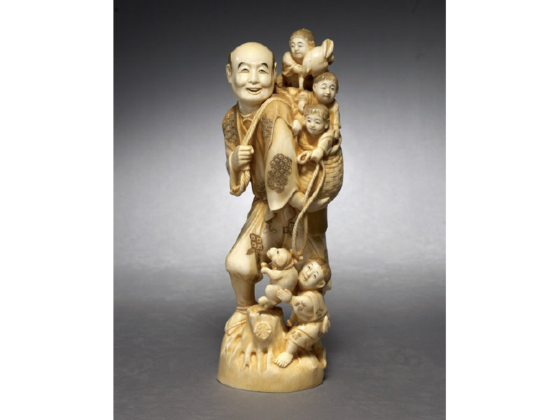 Appraisal: FINE JAPANESE CARVED IVORY FIGURE GROUP Walking with a child