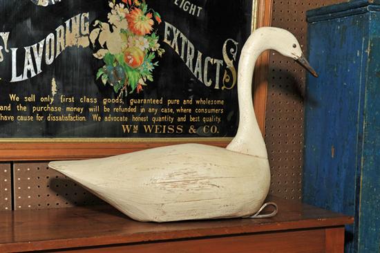 Appraisal: GOOSE DECOY White painted decoy with leather strap lead weight