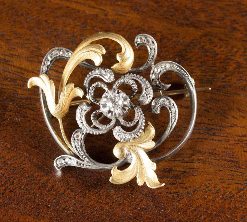 Appraisal: VINTAGE DIAMOND SILVER AND GOLD PENDANT BROOCH The silver and