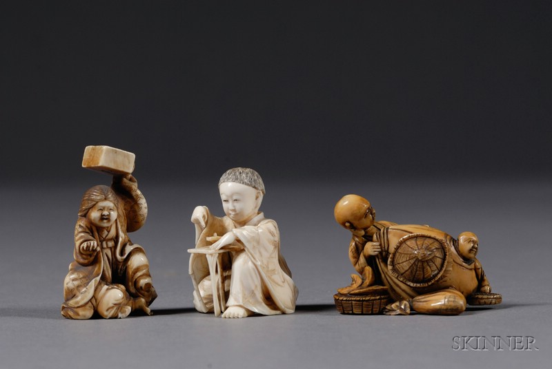 Appraisal: Three Ivory Netsuke th century a small boy two men