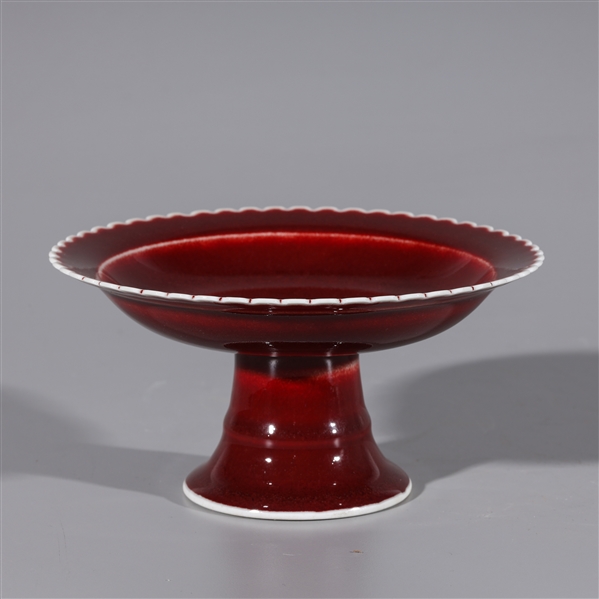 Appraisal: Chinese porcelain red glaze serving dish with scalloped edges and