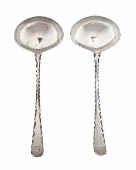 Appraisal: A Pair of English Silver Sauce Ladles George Smith London