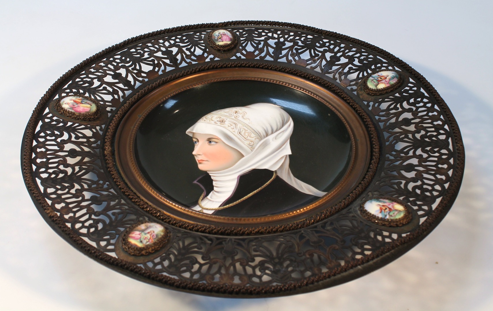 Appraisal: A hand painted Vienna style porcelain plaque the circular outline