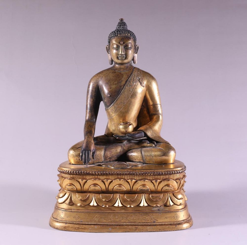 Appraisal: CHINESE GILT BRONZE SKYAMUNI BUDDHA SCULPTURE Chinese gilt bronze seated