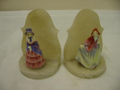 Appraisal: A PAIR OF DOULTON FIGURAL BOOKENDS comprising Victorian Lady M