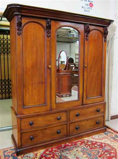 Appraisal: A VICTORIAN MAHOGANY WARDROBE Scottish th century centering an inset