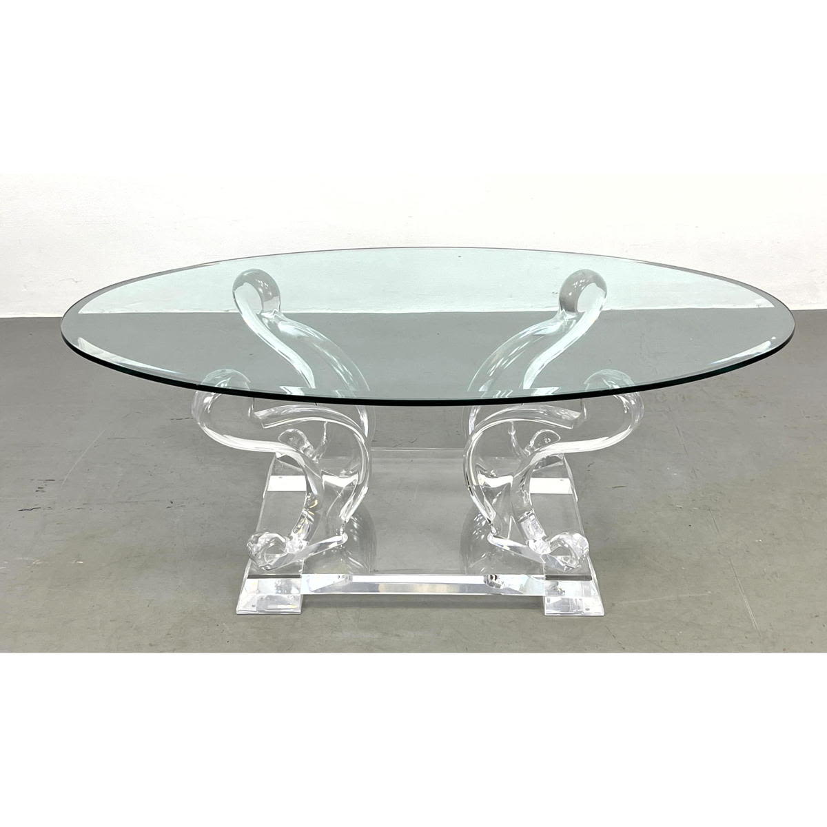 Appraisal: Modernist Glass Top Coffee Table with Lucite Scroll Design Base