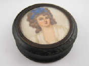 Appraisal: An ebonised treen rouge pot cm dia the lid with