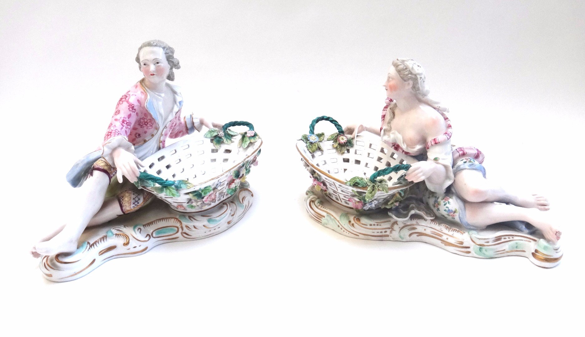 Appraisal: A pair of Meissen style porcelain figural sweetmeat dishes late