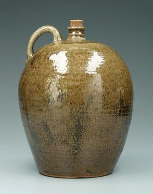 Appraisal: Edgefield four gallon jug mottled and runny olive alkaline glaze