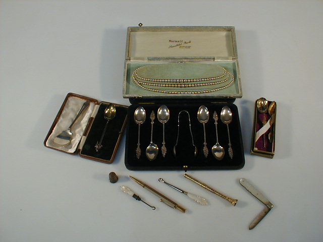 Appraisal: Costume pearls cased silver tea spoons commemorative spoons two propelling