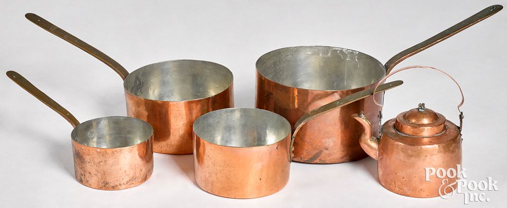 Appraisal: Nest of four dovetailed copper pots Nest of four dovetailed