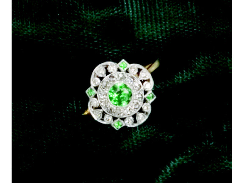 Appraisal: TSAVORITE AND DIAMOND RING k white gold ring with beaded