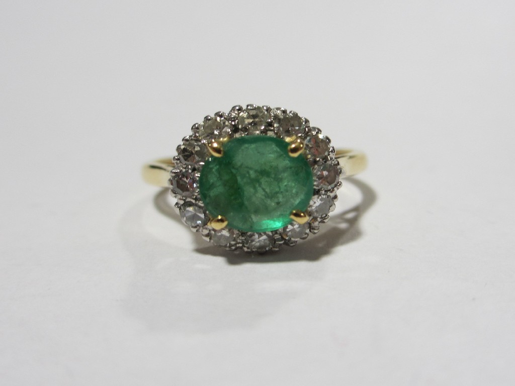 Appraisal: Eighteen carat gold emerald and diamond cluster ring with round