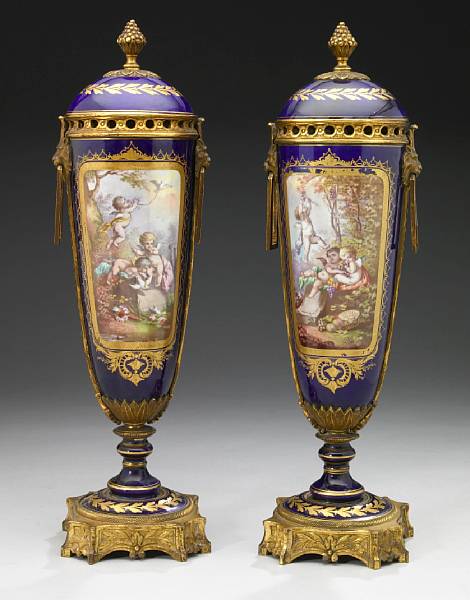 Appraisal: A pair of Sevres style gilt bronze mounted porcelain covered