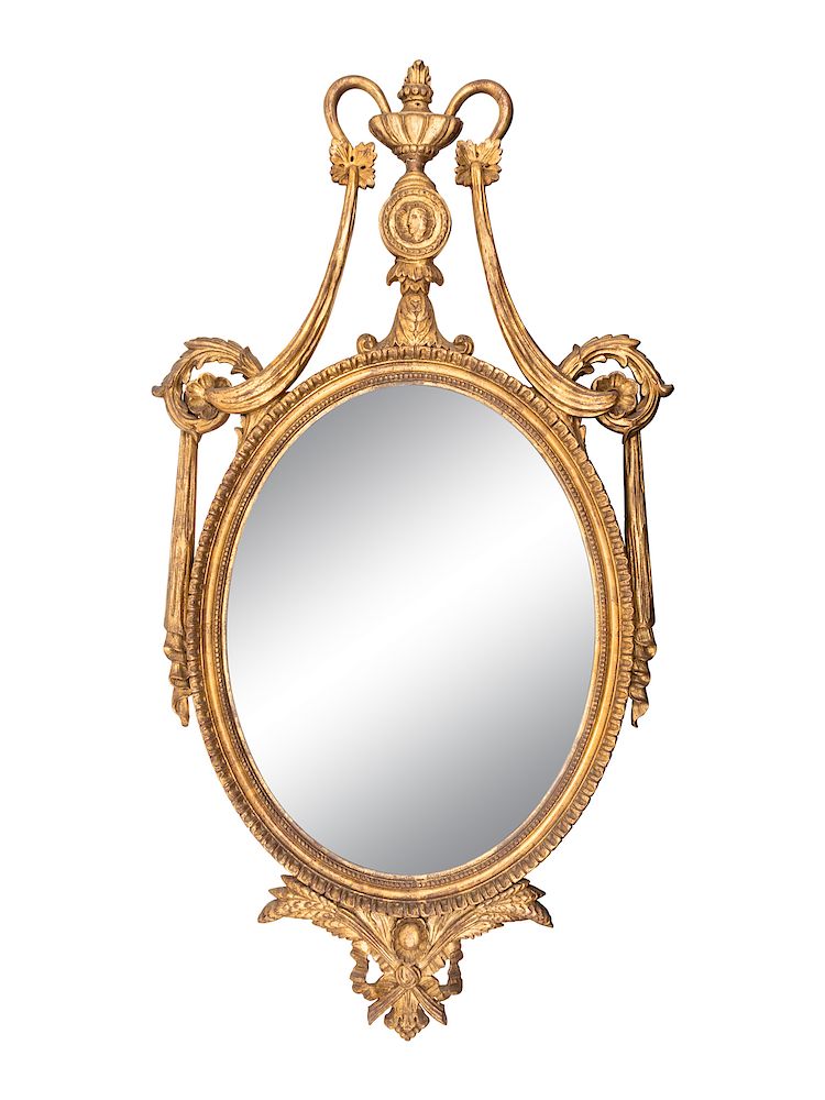 Appraisal: A Neoclassical Style Oval Giltwood Mirror Height inches A Neoclassical