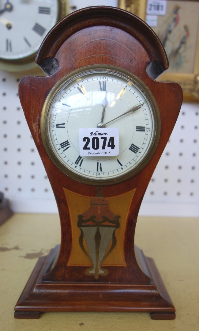 Appraisal: A mahogany cased Art Nouveau mantel clock of pinched waist