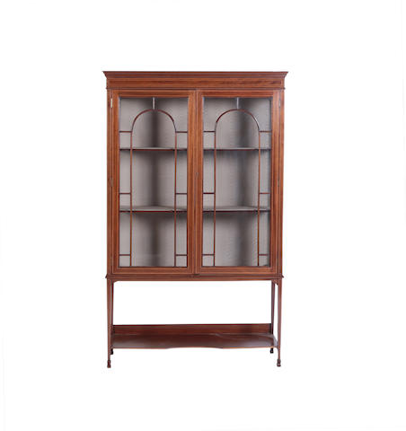 Appraisal: An Edwardian Mahogany and chequer-banded display cabinet The projecting cornice