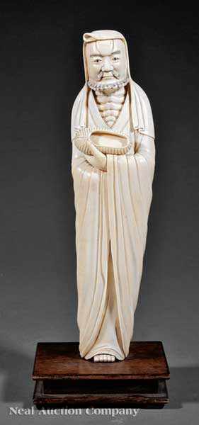 Appraisal: A Chinese Carved Ivory Figure of Luohan standing bearded figure