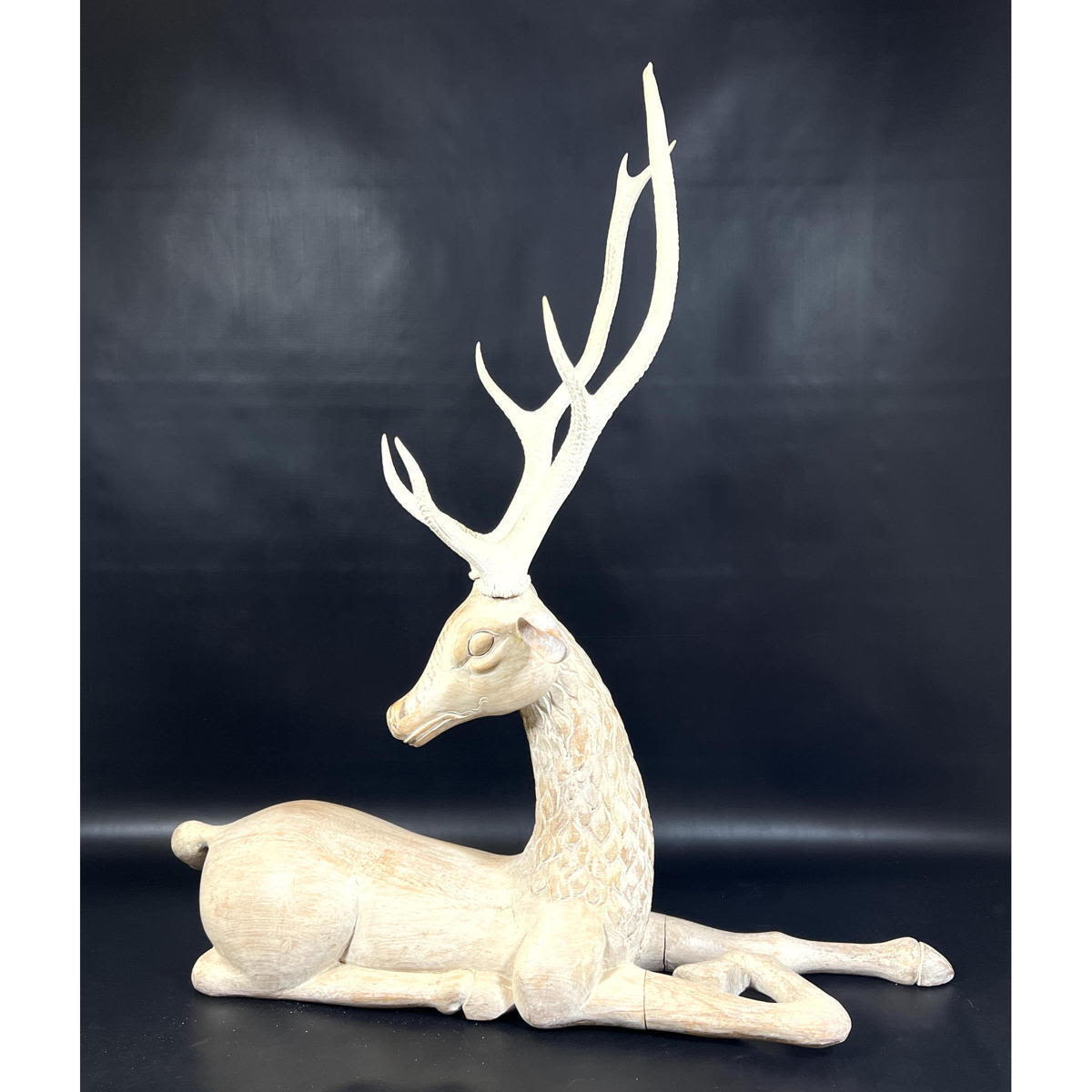 Appraisal: Large carved pine wood recumbent deer with real antlers White