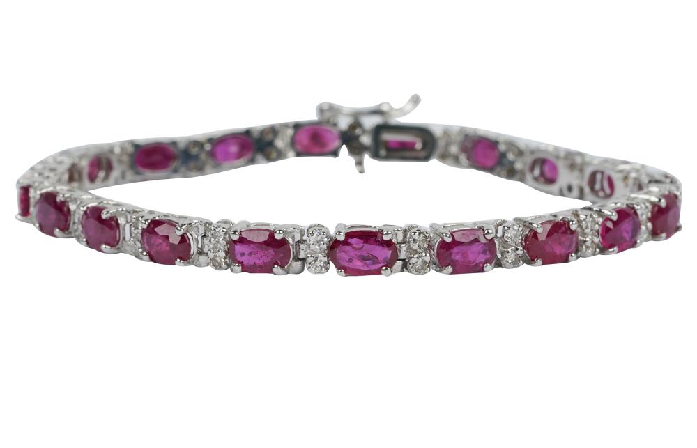 Appraisal: KARAT WHITE GOLD DIAMOND RUBY STRAIGHTLINE BRACELETcontaining oval mixed cut