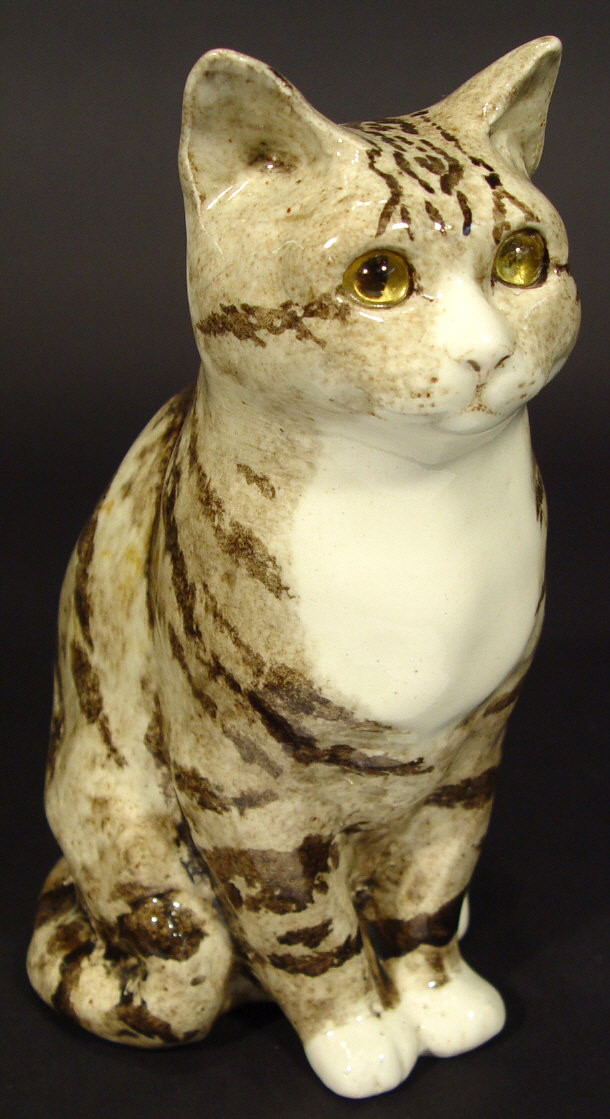 Appraisal: Winstanley china cat with hand painted decoration and glass eyes