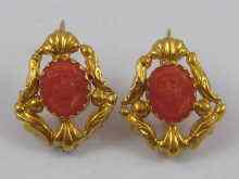 Appraisal: A pair of yellow metal tests ct gold coral cameo