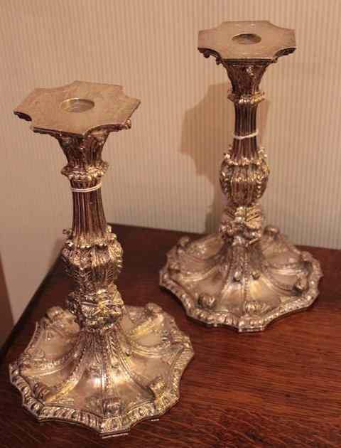 Appraisal: A PAIR OF TH CENTURY STYLE SILVER PLATED CANDLESTICKS with